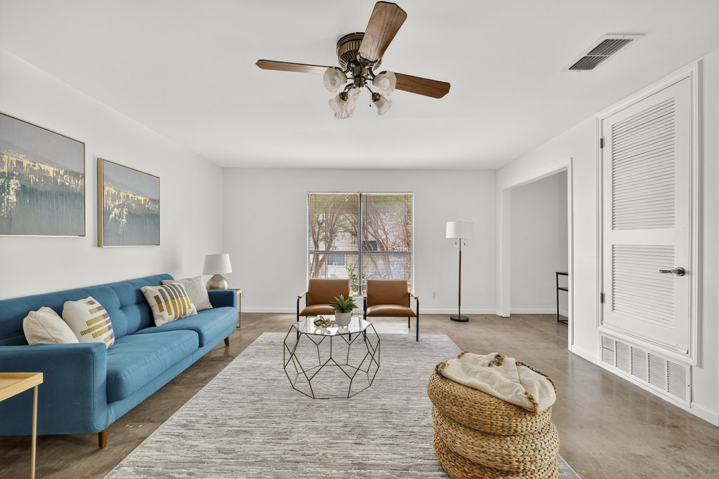 2202 Cypress Point East Austin, TX 78746 - Photo 6 of 36 The living room feature a light and airy aesthetic with bright walls.