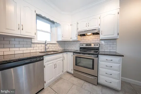 a bathroom with a sink and a window