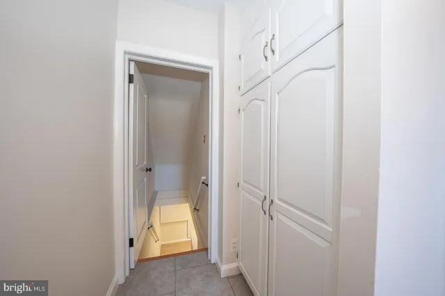 a kitchen with stainless steel appliances a refrigerator sink and cabinets