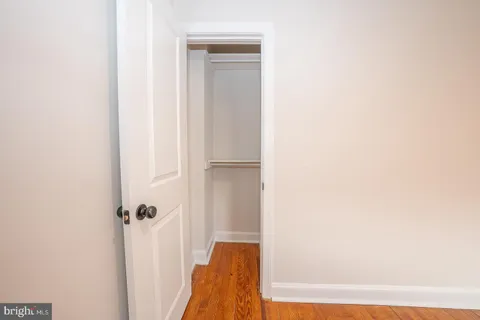 a view of bathroom with bathtub and wooden floor