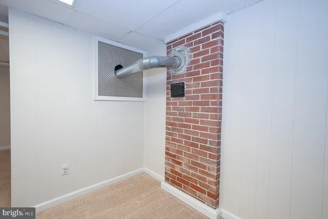 a view of a room with wooden walls