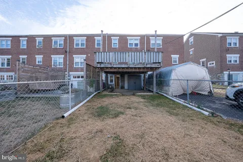 a view of a brick house with many windows