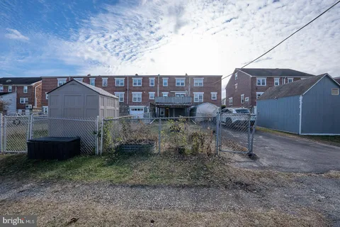 a view of balcony with wooden fence and floor