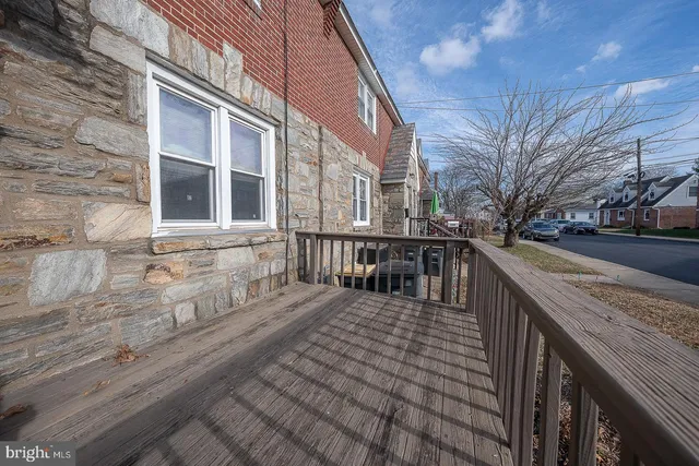 a view of a cars park in front of a building
