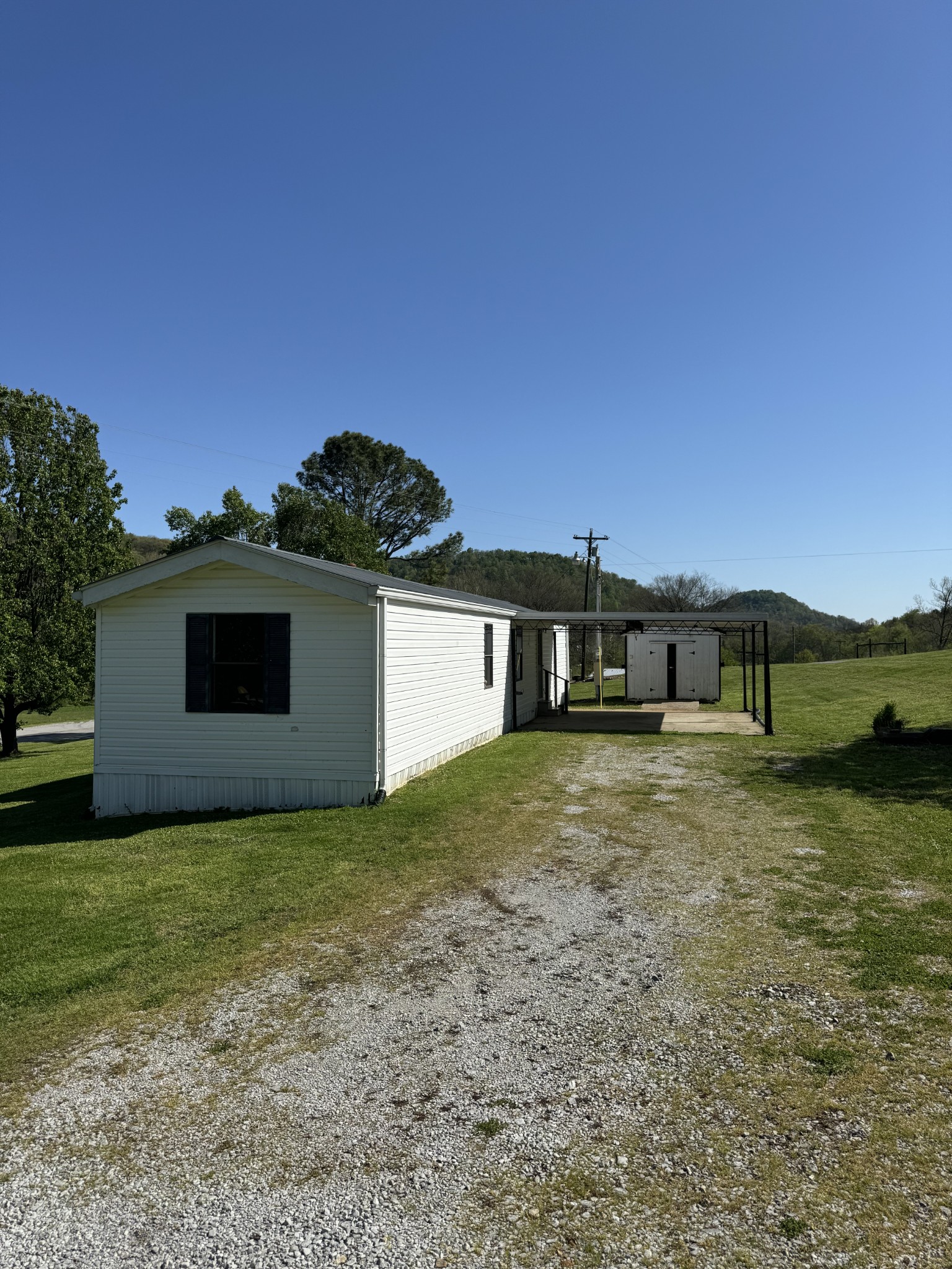 57 Difficult Road Pleasant Shade, TN 37145 - Photo 3 of 18 a front view of a house with a yard