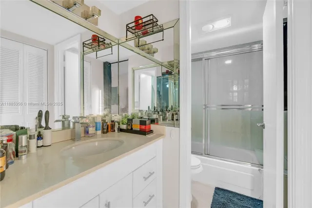 a bathroom with a double vanity sink and a mirror