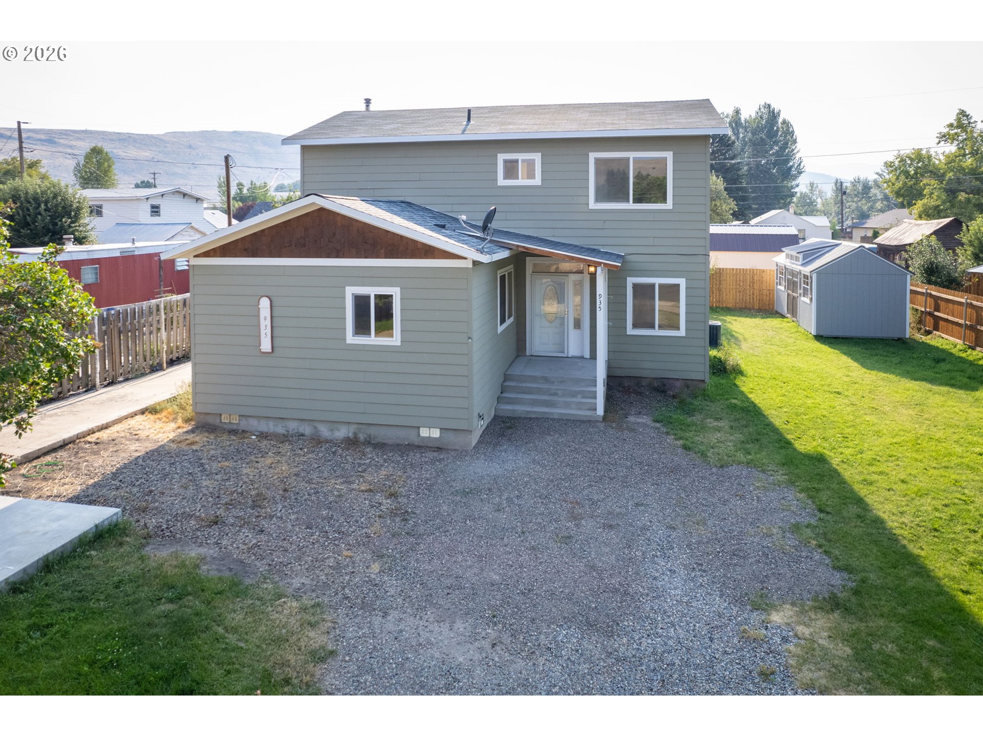 935 Walnut Street Baker City, OR 97814 - Photo 1 of 1 a front view of a house with garden