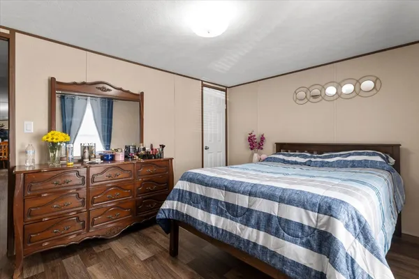 a kitchen with stainless steel appliances a sink a stove top oven a counter space and cabinets