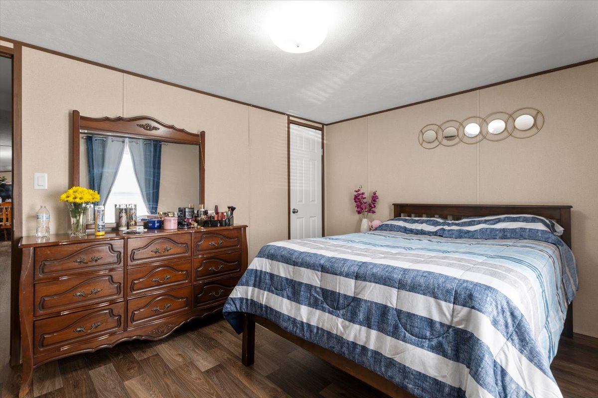 341 Southwest Front Street Bartlett, TX 76511 - Photo 11 of 23 a bedroom with a bed and dresser