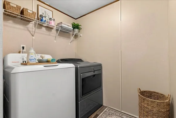 a bathroom with a granite countertop sink toilet and a mirror