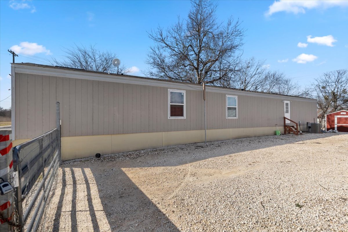 341 Southwest Front Street Bartlett, TX 76511 - Photo 2 of 23 a view of a backyard of the house