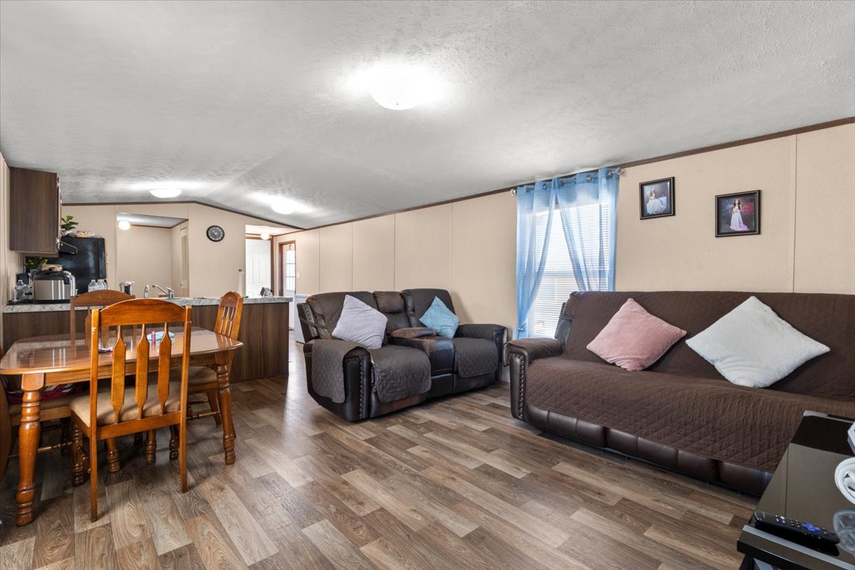 341 Southwest Front Street Bartlett, TX 76511 - Photo 20 of 23 a living room with furniture and wooden floor
