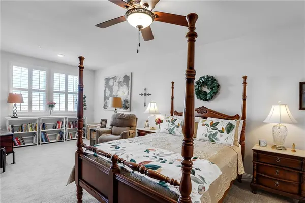 a bed room with bed and window