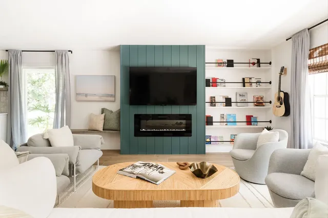 a living room with furniture and a fireplace