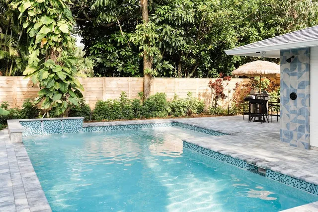 a view of a swimming pool with a patio