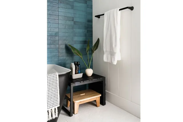 a view of a dining room with furniture and a window