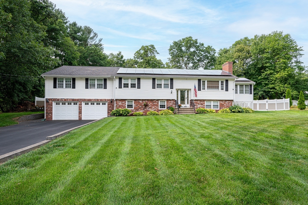 a view of a house with a big yard