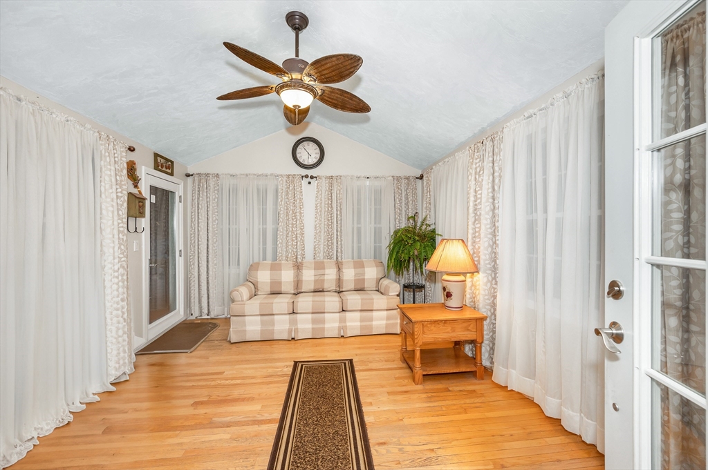 6 Montclair Circle Billerica, MA 01821 - Photo 13 of 42 a bedroom with a bed and a chandelier