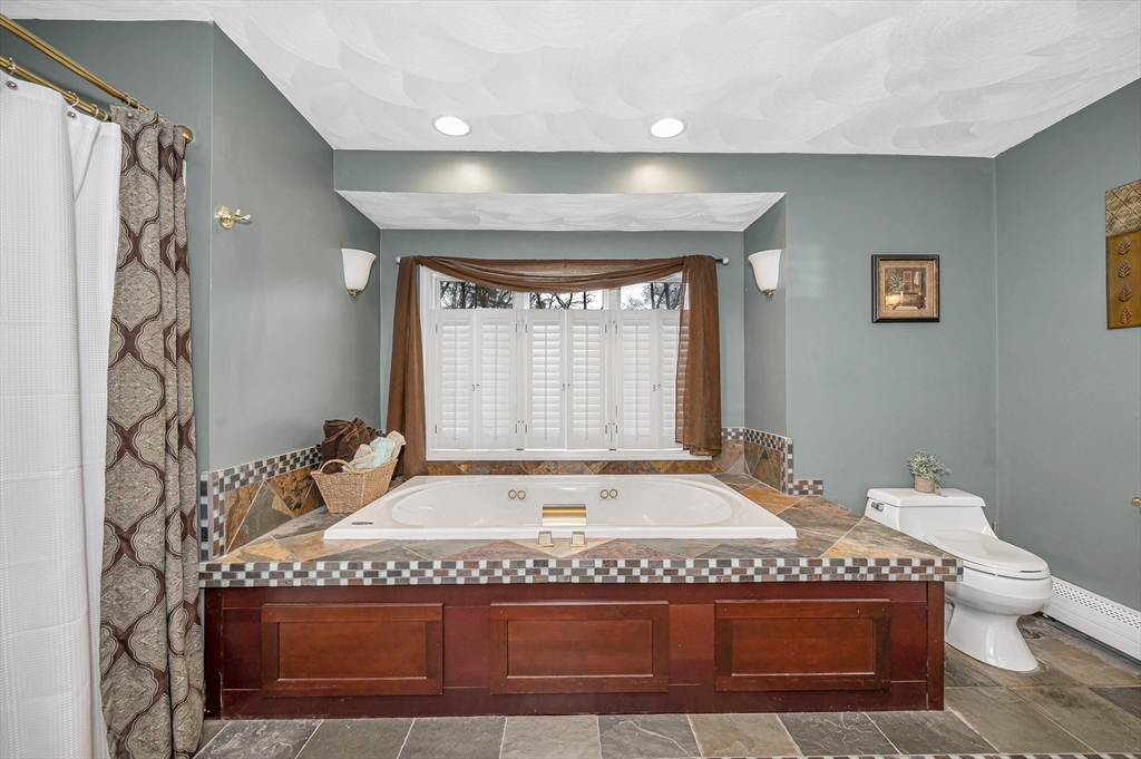 6 Montclair Circle Billerica, MA 01821 - Photo 17 of 42 a spacious bathroom with a granite countertop tub and a window