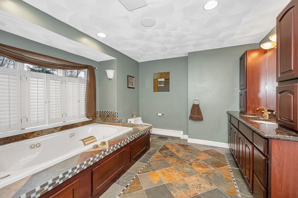 6 Montclair Circle Billerica, MA 01821 - Photo 19 of 42 a bed room with a bed and a large window