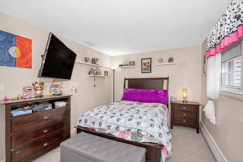 6 Montclair Circle Billerica, MA 01821 - Photo 20 of 42 a bedroom with a bed and flat screen tv