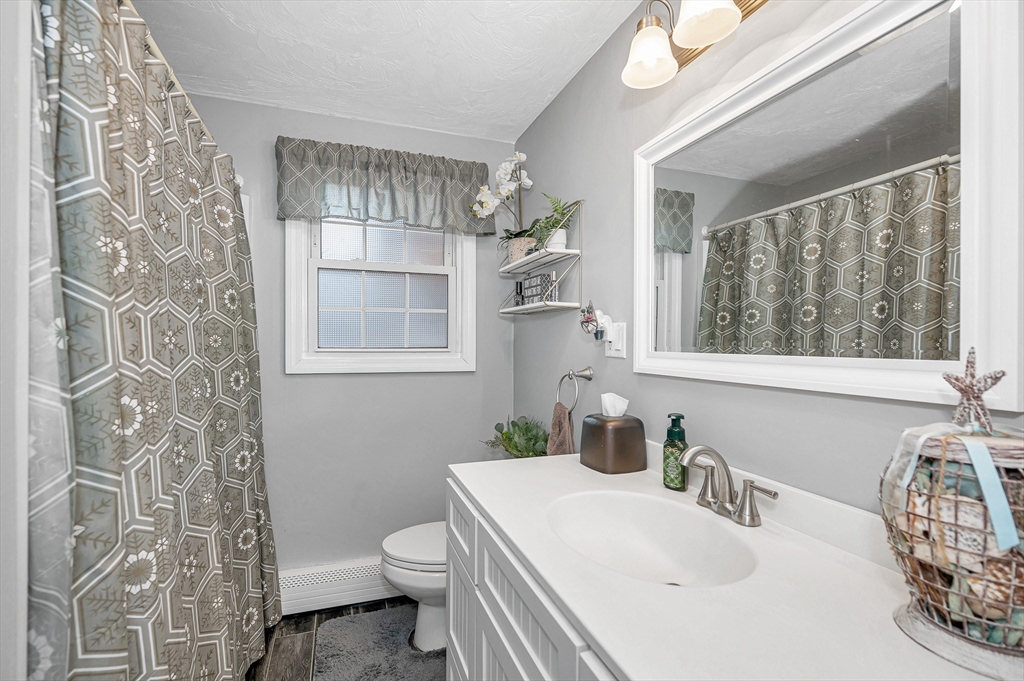 6 Montclair Circle Billerica, MA 01821 - Photo 21 of 42 a bathroom with a sink a toilet and a mirror