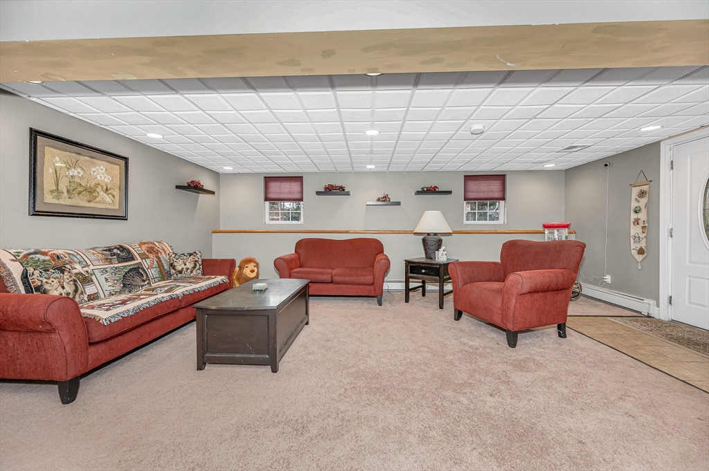 6 Montclair Circle Billerica, MA 01821 - Photo 25 of 42 a living room with furniture and a ceiling fan
