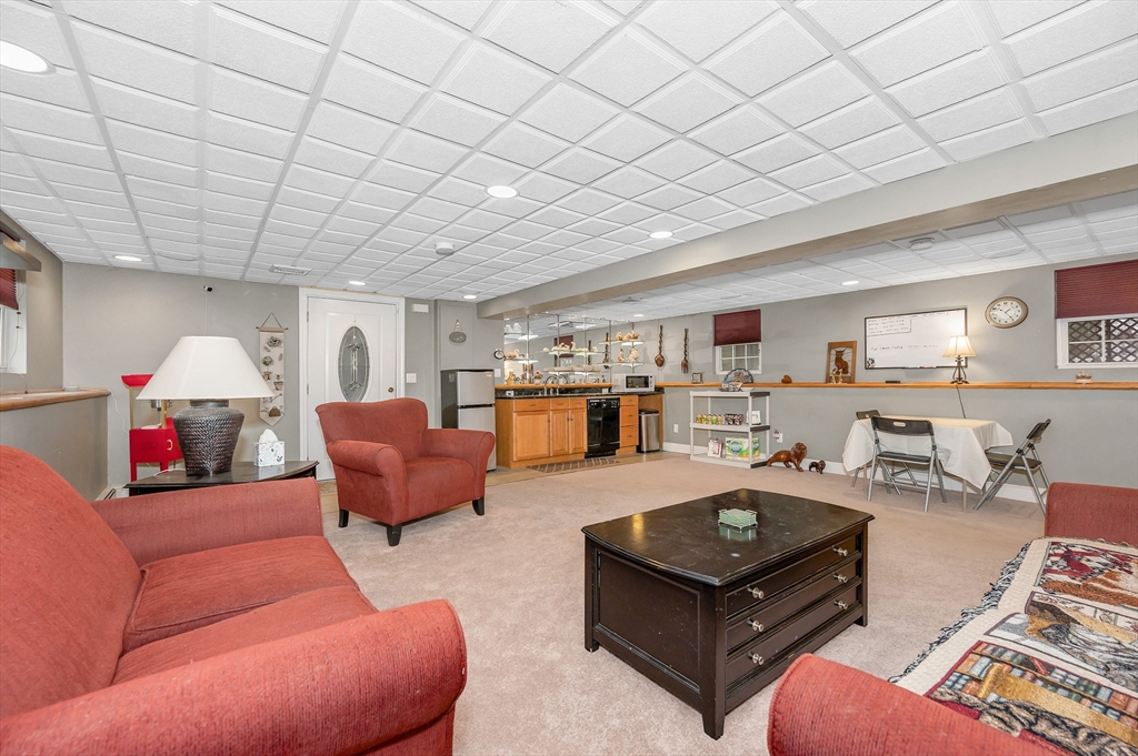 6 Montclair Circle Billerica, MA 01821 - Photo 26 of 42 a living room with furniture and a wooden floor