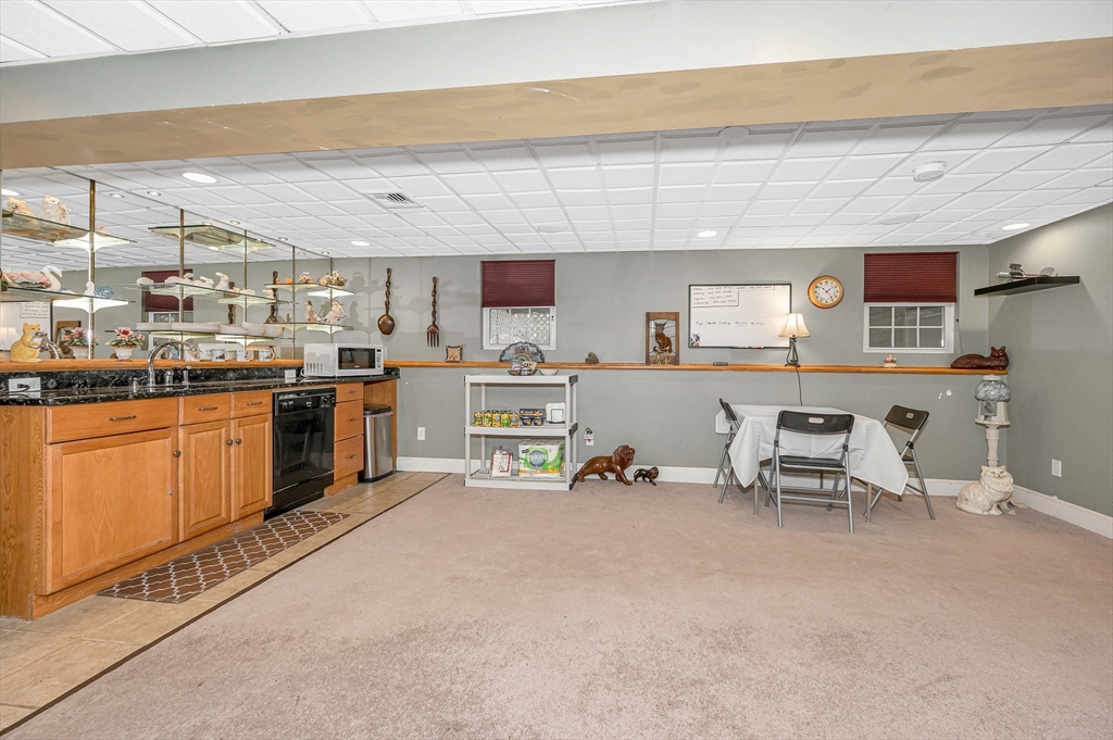6 Montclair Circle Billerica, MA 01821 - Photo 27 of 42 a living room with stainless steel appliances kitchen island granite countertop furniture and a kitchen view