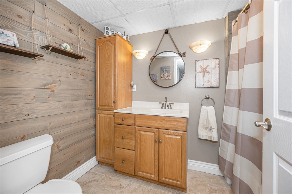 6 Montclair Circle Billerica, MA 01821 - Photo 28 of 42 a bathroom with a sink vanity mirror and toilet