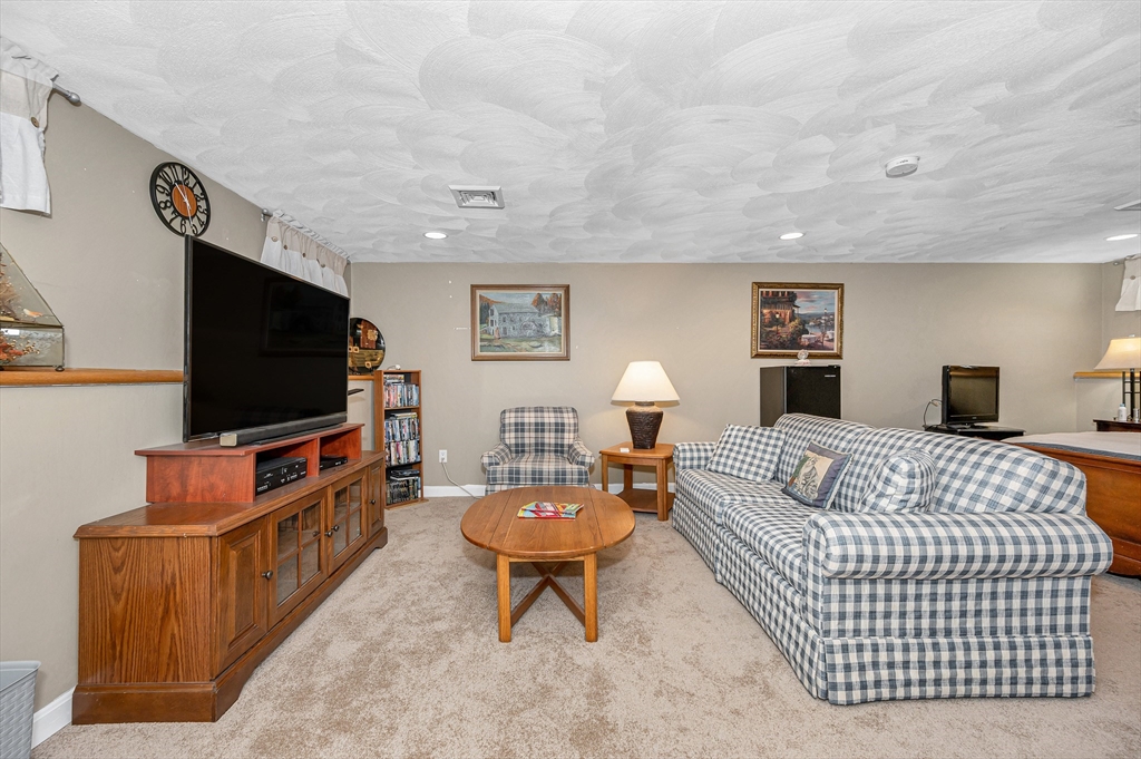 6 Montclair Circle Billerica, MA 01821 - Photo 30 of 42 a living room with furniture and a flat screen tv