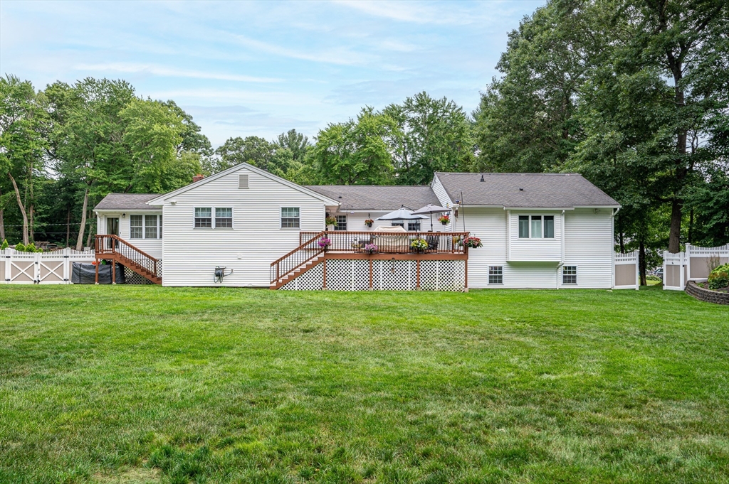 6 Montclair Circle Billerica, MA 01821 - Photo 38 of 42 a front view of a house with a garden
