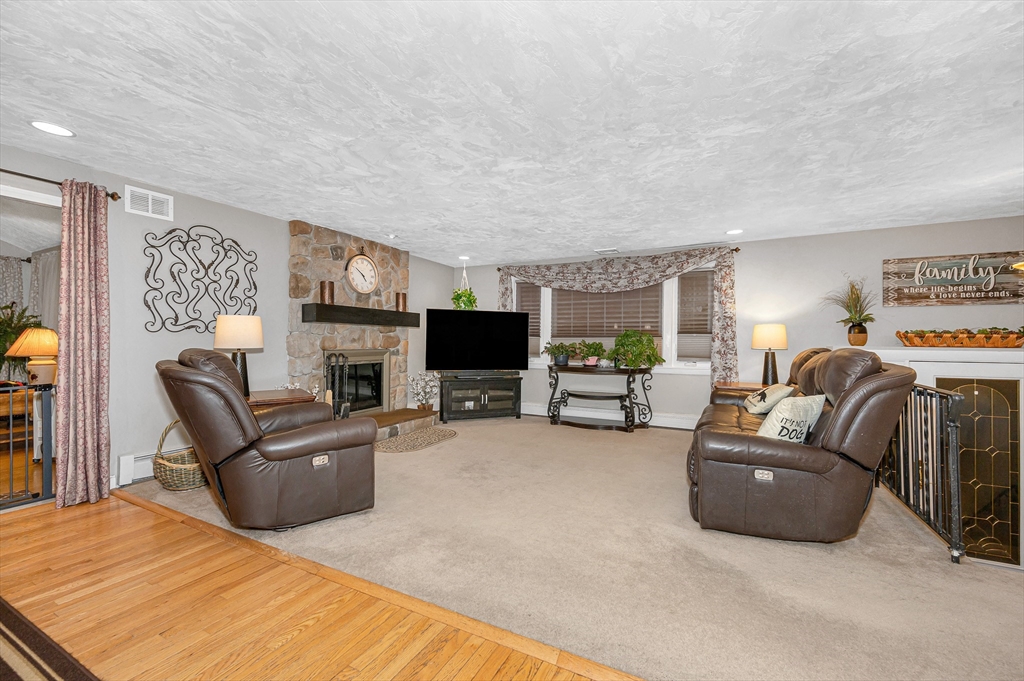 6 Montclair Circle Billerica, MA 01821 - Photo 10 of 42 a living room with furniture and a flat screen tv
