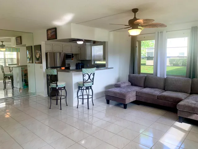 a living room with furniture and a window