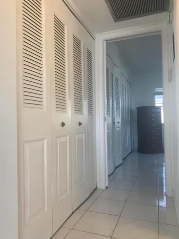 a bedroom with a bed and a cabinets