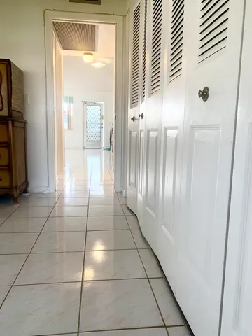 a view of a refrigerator in a kitchen