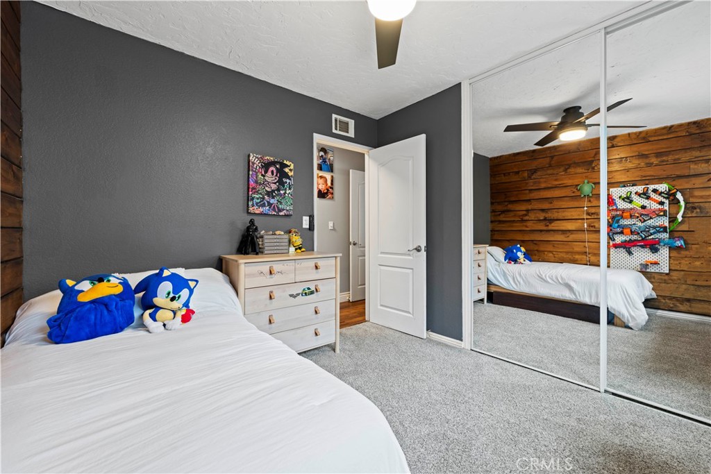 23255 Redbud Ridge Circle Valencia, CA 91354 - Photo 13 of 19 a bedroom with a bed and a refrigerator
