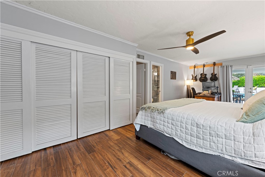 23255 Redbud Ridge Circle Valencia, CA 91354 - Photo 16 of 19 a bed room with a bed and a ceiling fan