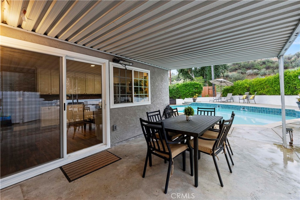 23255 Redbud Ridge Circle Valencia, CA 91354 - Photo 18 of 19 a view of a patio with a table and chairs
