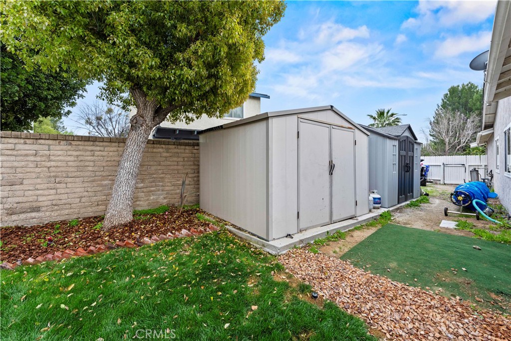23255 Redbud Ridge Circle Valencia, CA 91354 - Photo 19 of 19 a backyard of a house with lots of green space