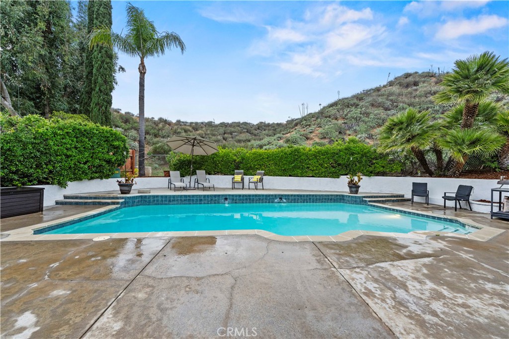 23255 Redbud Ridge Circle Valencia, CA 91354 - Photo 4 of 19 a view of green field with tree in the background