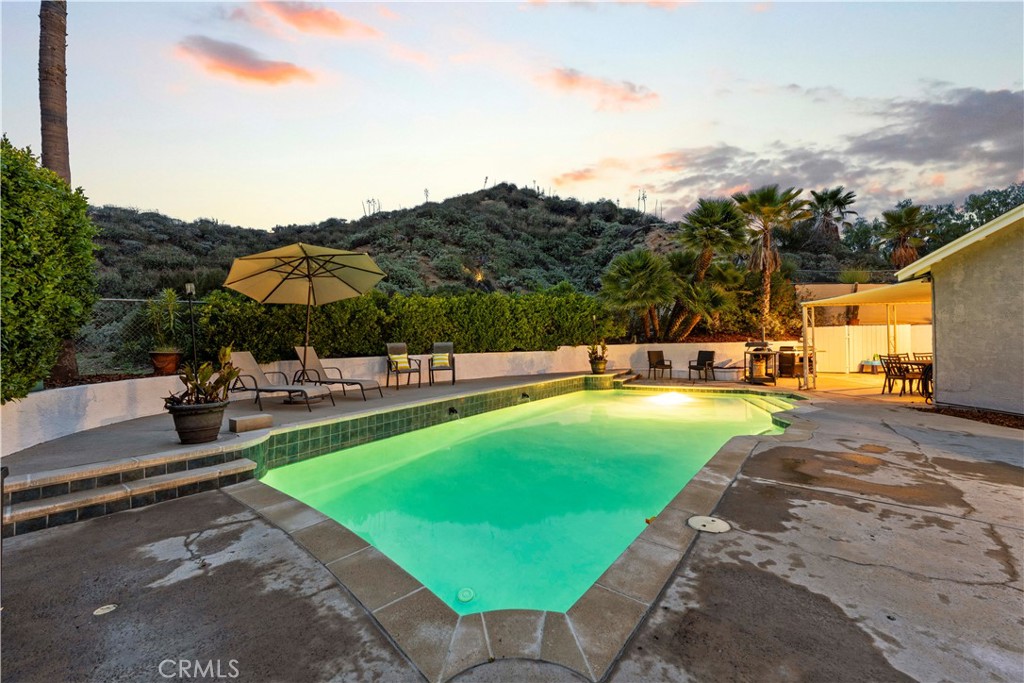 23255 Redbud Ridge Circle Valencia, CA 91354 - Photo 5 of 19 a view of a swimming pool with lounge chairs