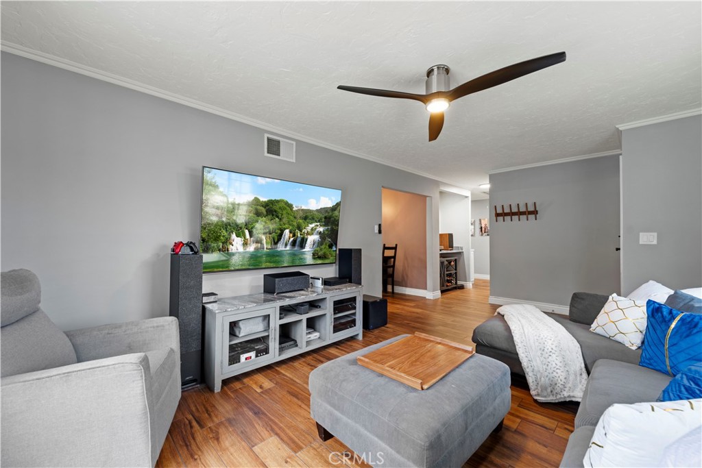23255 Redbud Ridge Circle Valencia, CA 91354 - Photo 9 of 19 a living room with furniture and a flat screen tv