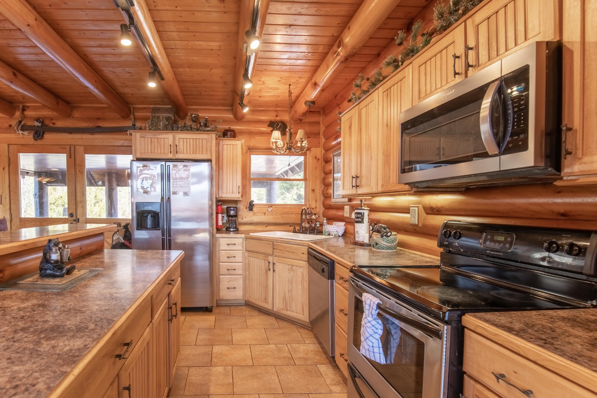 3005 Redtail Road Sevierville, TN 37862 - Photo 13 of 37 a kitchen with stainless steel appliances granite countertop a stove a sink and a microwave