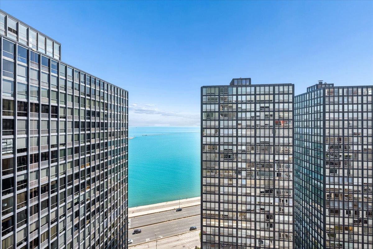 253 East Delaware Place, Unit 11F Chicago, IL 60611 - Photo 13 of 19 a view of a building with glass door