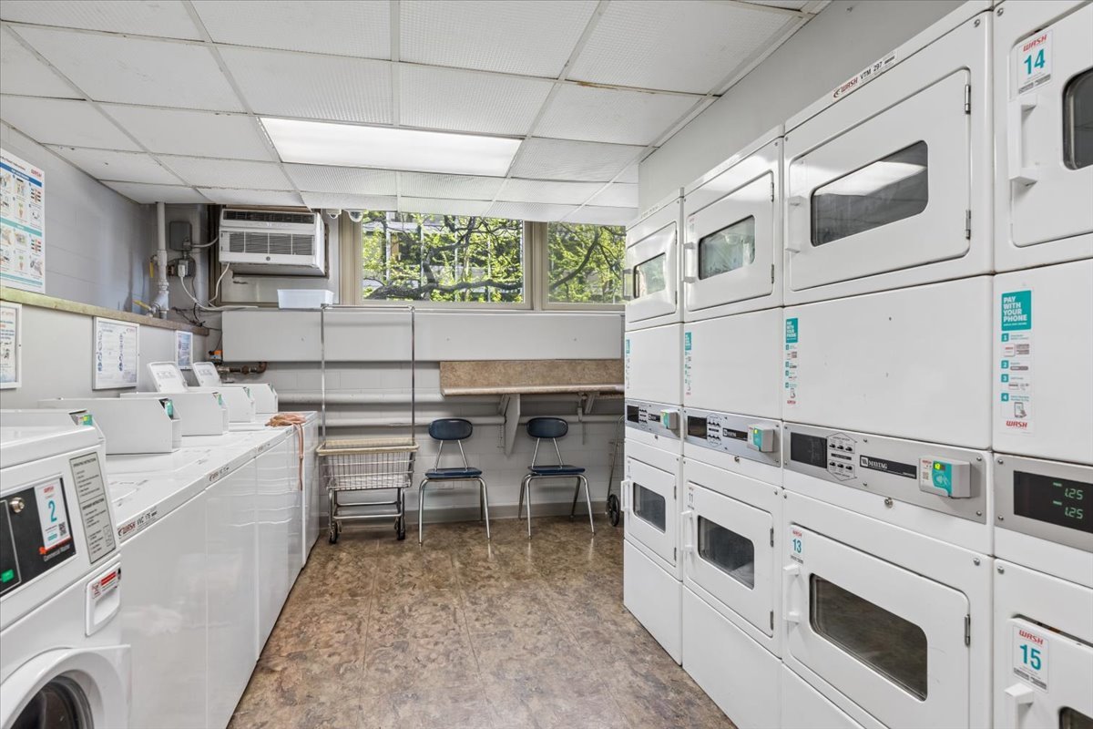 253 East Delaware Place, Unit 11F Chicago, IL 60611 - Photo 15 of 19 a kitchen with stainless steel appliances a stove a sink and a refrigerator
