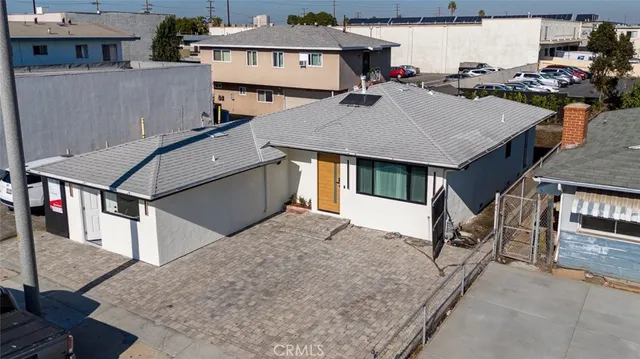 an aerial view of a house with roof deck