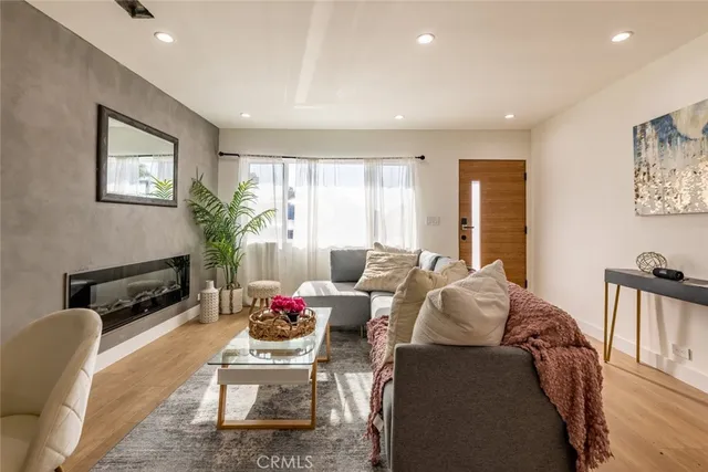 a spacious bedroom with a bed and a table in it