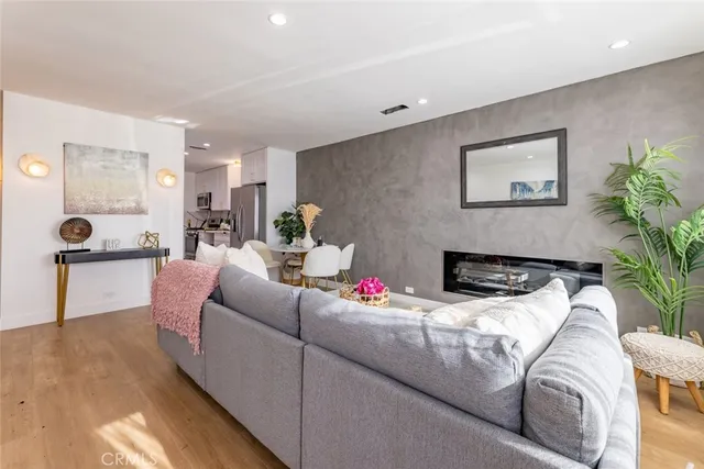 a living room with furniture potted plant and a window