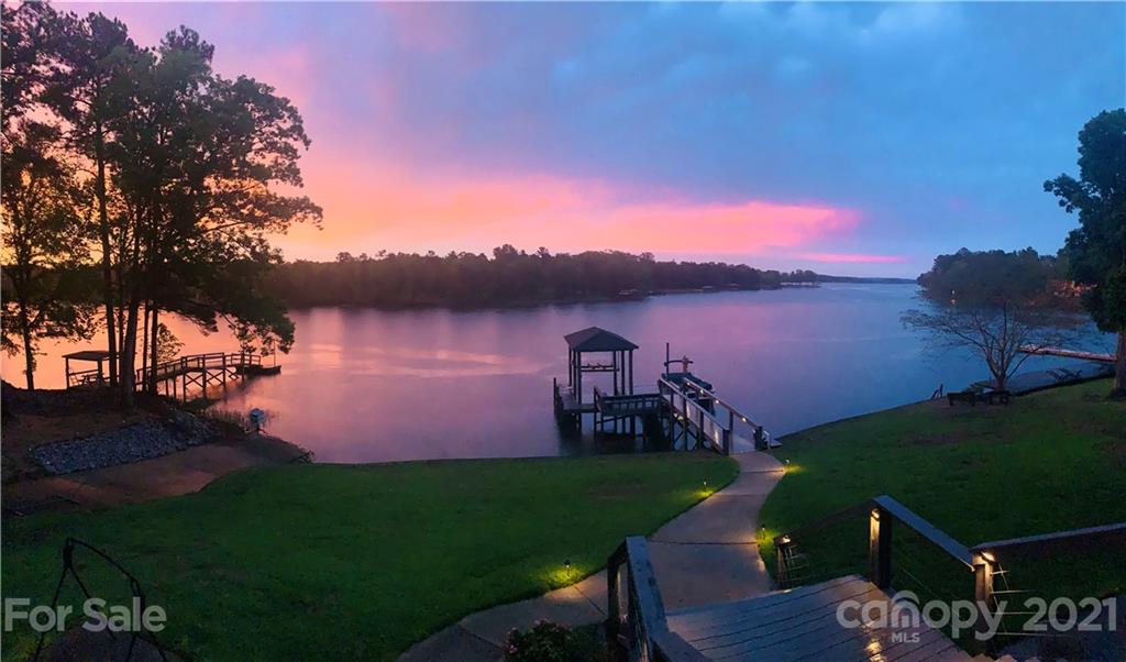 437 State Rd S-20-457 Ridgeway, SC 29130 - Photo 1 of 48 a view of a lake with a house in the background